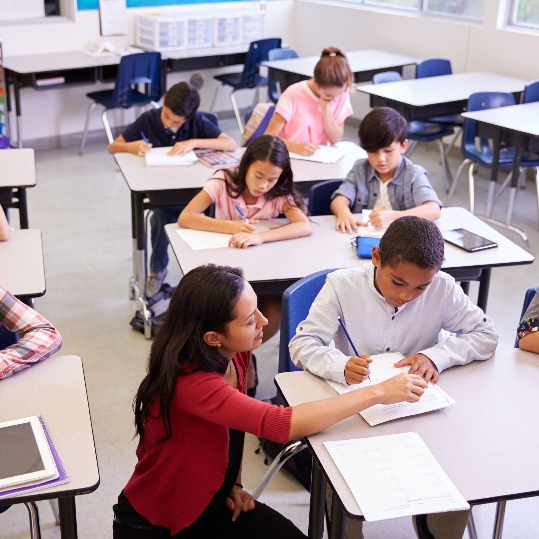 teacher helping student