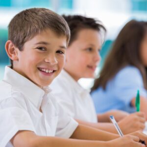 Little boy smiling in class