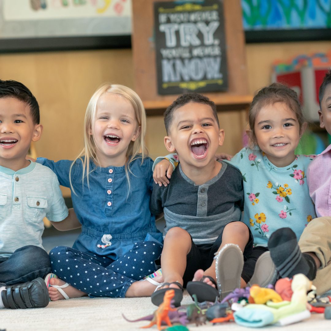 smiling kids sitting together
