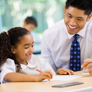 teacher working with student