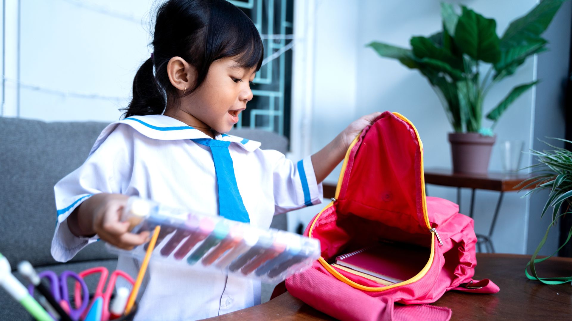 girl packing backpack
