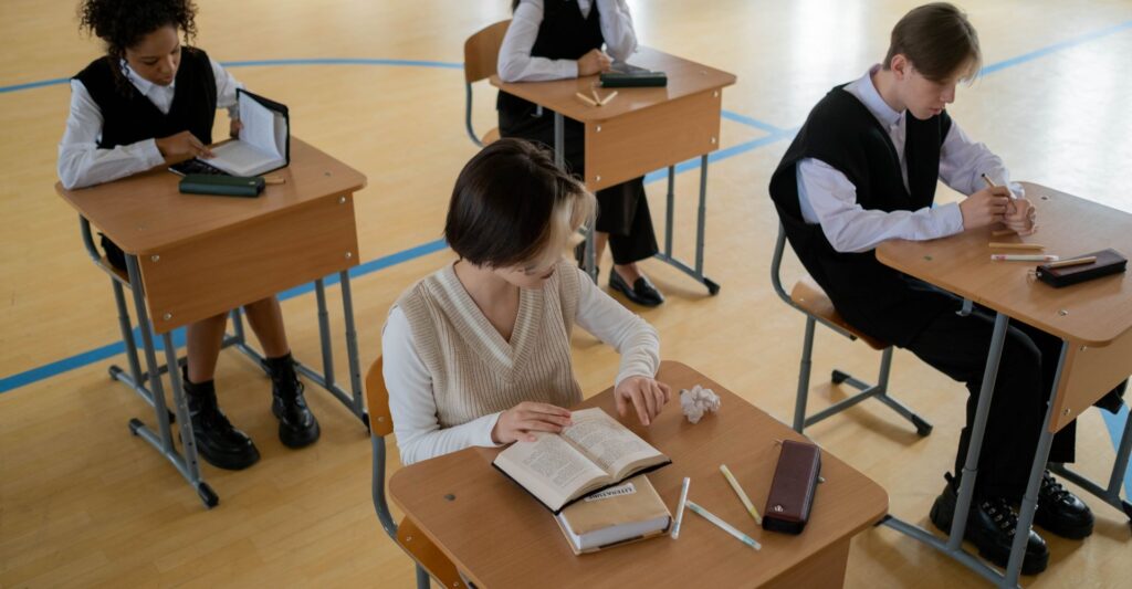 Students completing a test at their desk