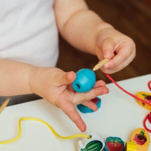 Child playing with a toy. 