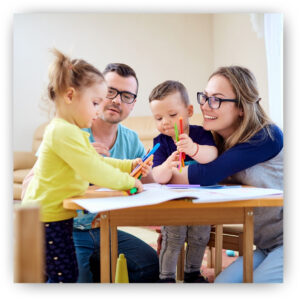 Parents helping their kids color