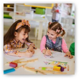 preschool girls laughing together