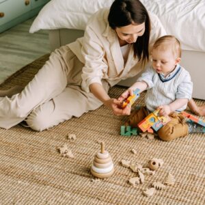 toddler and mom playing with toys