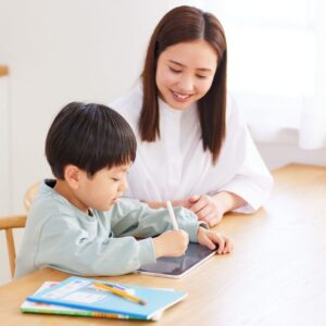 mom and son using tablet