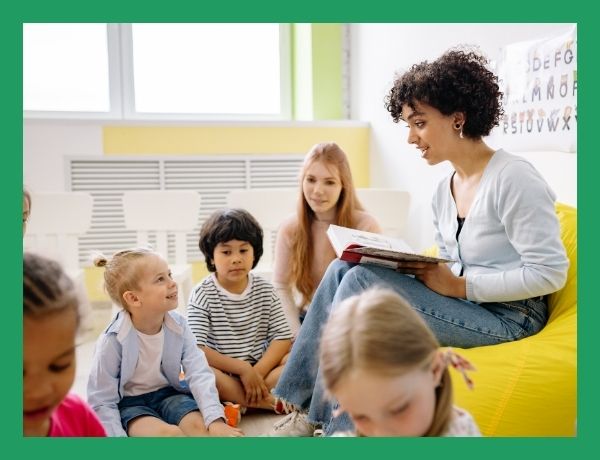teacher reading to preschool children