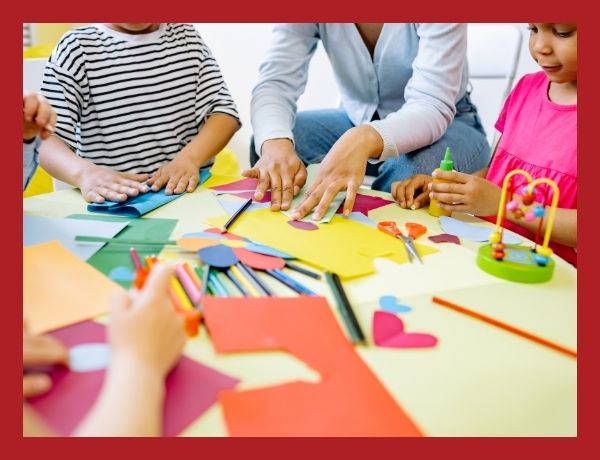 kids doing an arts and crafts project with colored construction paper