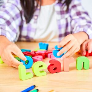 A child playing with letter blocks